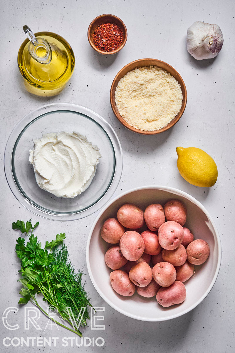 Crispy Parmesan Potatoes with Herby Yogurt and Chili Oil