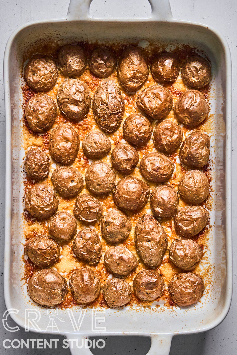 Crispy Parmesan Potatoes with Herby Yogurt and Chili Oil