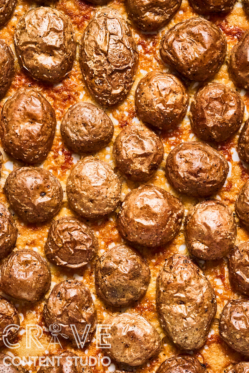 Crispy Parmesan Potatoes with Herby Yogurt and Chili Oil