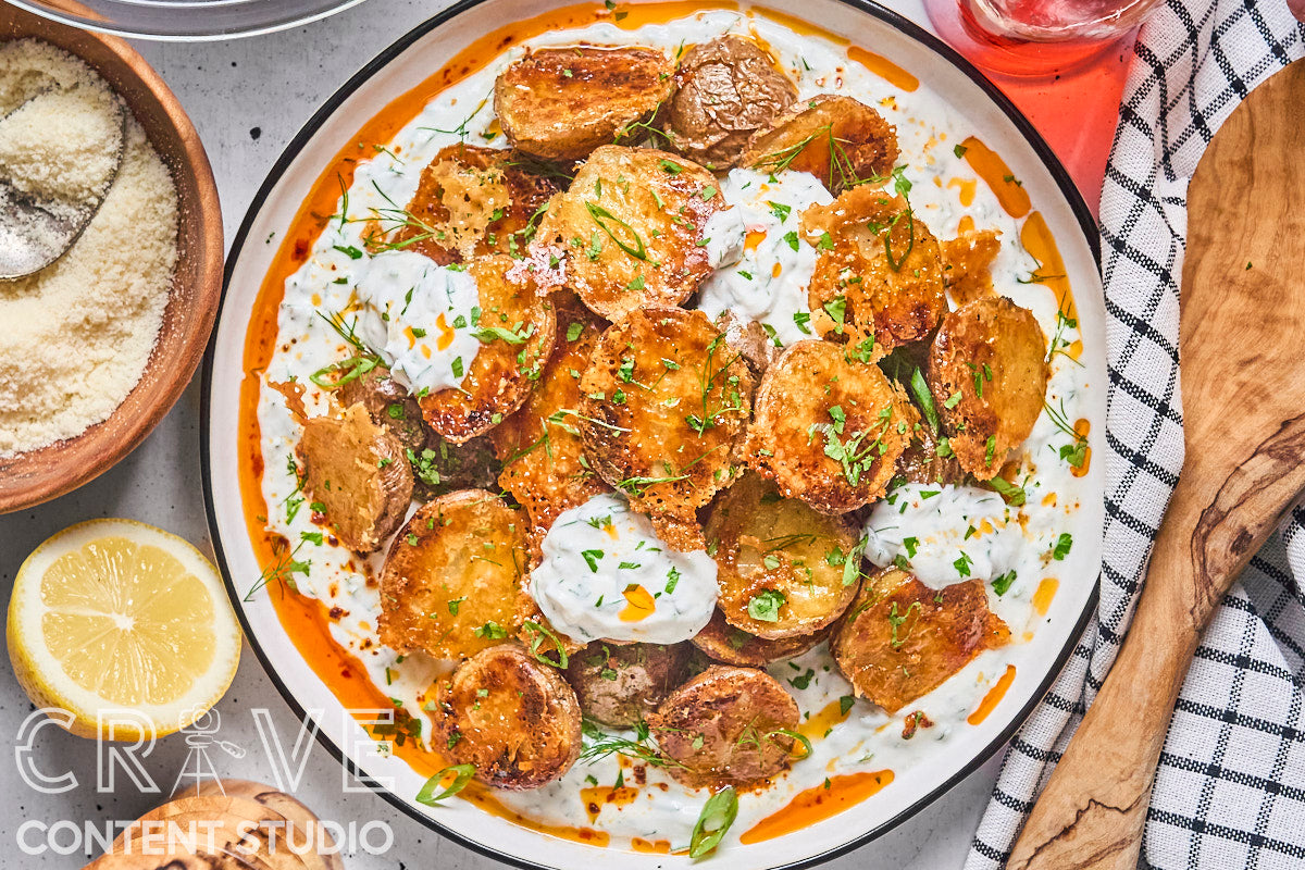 Crispy Parmesan Potatoes with Herby Yogurt and Chili Oil