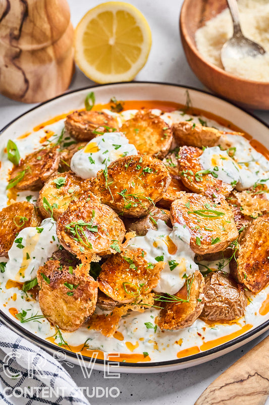 Crispy Parmesan Potatoes with Herby Yogurt and Chili Oil